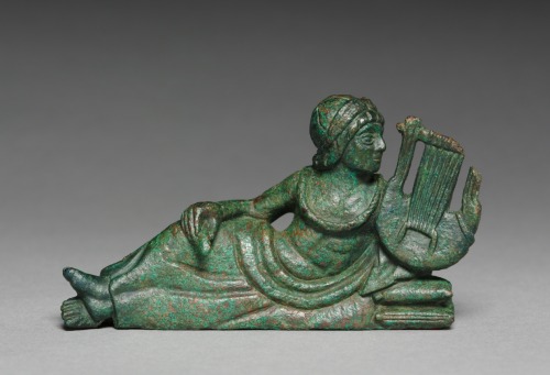 cma-greek-roman-art:Vessel Ornament of Reclining Lyre-player, probably 400-375 BC, Cleveland Museum 