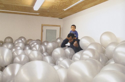 Noah Davis with son Moses in a work by Martin Creed, Work 360: Half the Air in a Given Space, 2004, 