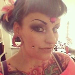 cecer:  Out on a date with my man. #hungergames #piercings # tattoo #strechedears #makeup #pigtails #bluehair #cyberdog #sugarpillcosmetics