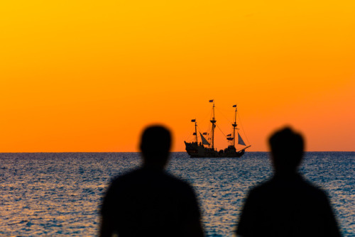 Sunsets and good conversations   The guys in the foreground are two of many visitors who flock to th