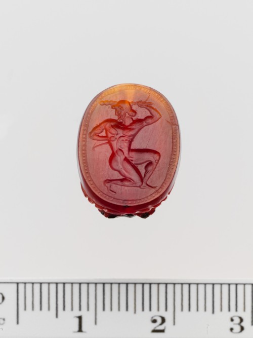 Carnelian scaraboid seal ca. 450-430 B.C.Herakles with bow and club. (Source)