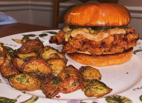 [I made] Fried chicken sandwich with pickles and smoked gouda, alongside roasted potatoes Check this