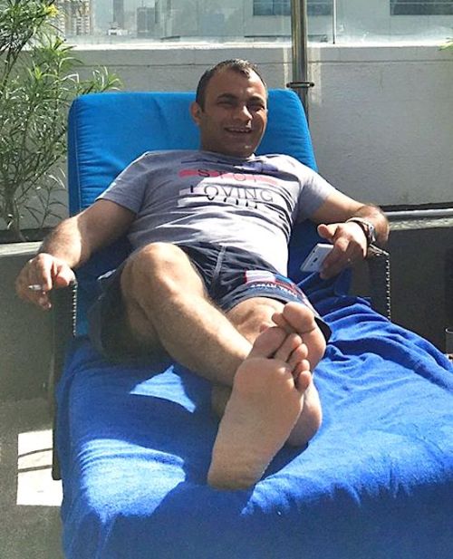 Alpha-Male-Feet:  Hassan Enjoying A Cigarette While Waiting For His Foot Massage.