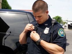 Policecorps:  Tattoo Just Peeking Out Under The Sleeve. Grrr.