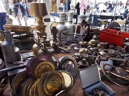 Brass, bronze &amp; other metals merchandise offered on antiquities market in Wroclaw, Poland.
