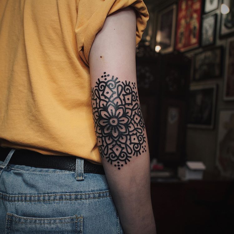 Tattoo Ideas — Black solid mandala tattoo on the elbow Black...