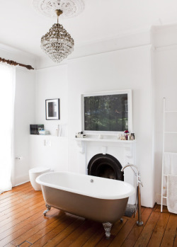 designed-for-life:  Amxing enormous bathroom which used to be a bedroom.  Clawfoot bath, chandelier, original fireplace, timber floorboards - you can’t go wrong!  ’ I loved the idea of a chandelier in the bathroom.