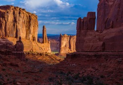 americasgreatoutdoors:  Arches National Park in Utah is a red rock wonderland. With a landscape of contrasting colors, landforms and textures, it is unlike any other in the world. Pictured here is the park’s majestic Park Avenue at sunrise. A 1-mile