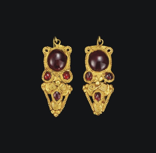 Pair of gold and garnet Roman earrings, c. 2nd century CE. From Christie’s auctions.