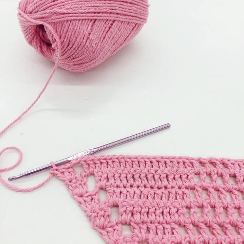 working on a halter top in petal pink