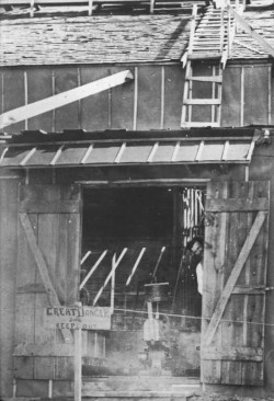 historicaltimes: Nikola Tesla looking out the door of his laboratory in Colorado Springs 1899 via reddit 