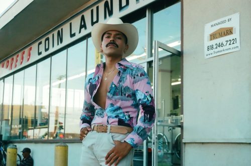 Jose in front of Laundromat, Lynwood, CA., 2017. From the series Brown Queer Rancheros.Fabian G