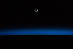 spaceexp:  A crescent moon and Earth’s