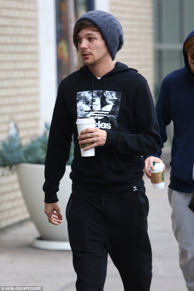 One Direction's Louis Tomlinson steps out after hitting back at 'fake baby'  fan rumours