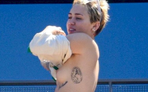 celebrity-nudes-leaked:  Miley Cyrus Caught Topless on a Balcony! 