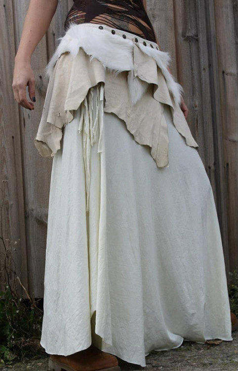 this skirt is made up of the softest lamb suede leather in a ivory shade.it is detailed with fluffy 