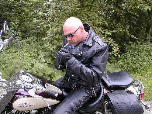 cigarjon:  cigartop:  Buck.  Sexy biker.