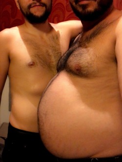 gainergut:  Real friends let friends rub bellies. I had to snap a photo of our difference in body size. He’s just too sexy next to my big belly.