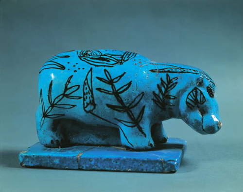 Statuette of a HippoThis benevolent-looking hippopotamus slips into the marshes, taking on their col