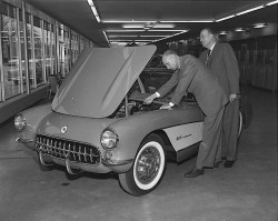 saychevrolet:Look at those fuel Injectors! 1957 Chevrolet Corvette and a couple suits.