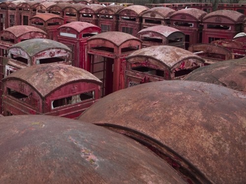 ruinationstation:UK’s red telephone box graveyard - Carlton Miniott