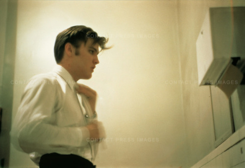 parishitme:Elvis Presley fixing his hair at the Mosque Theatre before two performances.