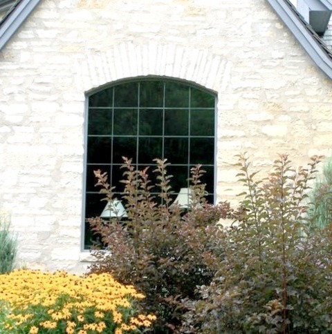 Roofing Tile In MilwaukeeInspiration For A Timeless Three-story Exterior Home Remodel With A Tile Roof