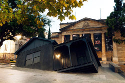 asylum-art:  “Landed”Installation by artistIan Strange As a part of the 2014 Adelaide Biennial of Australian Art, Aussie artist Ian Strange has opened his latest installation outside the Art Gallery of South Australia. Dubbed “Landed,” the architectural