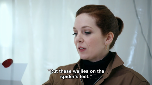 [ID: Six screencaps from Taskmaster. Katherine Parkinson is in a white room, reading from a piece of