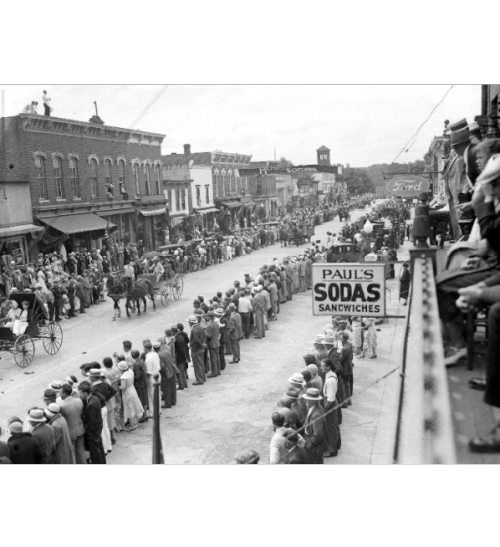 Crowd watches horse-drawn buggies at Milford, Michigan’s Centennial parade.1932