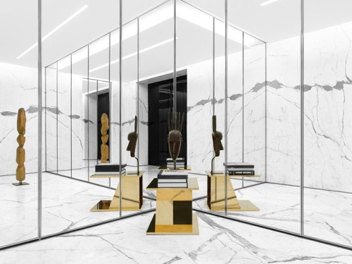 {Retail therapy… rendered in marble, gold, velvet, and tribal sculptures.}Designed by Hedi Sl