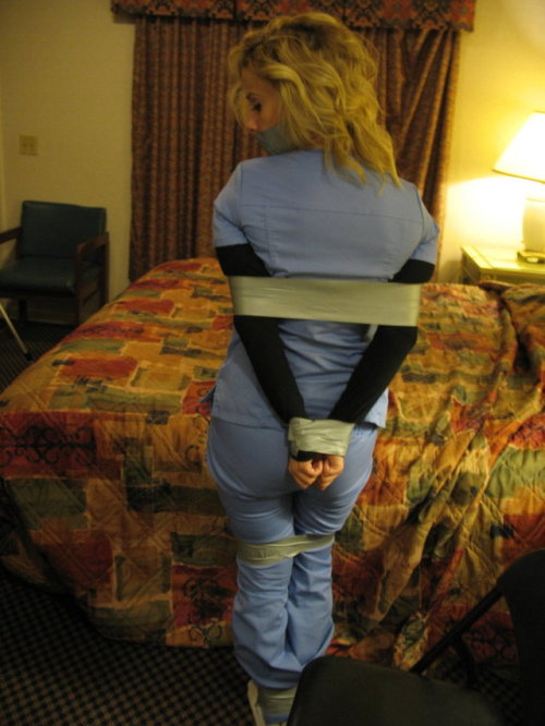 buckeyebound75:Having been left bound and gagged with duct tape by the infamous hotel bandit, Jamie tried desperately to free herself from the tape that bound her.  After an hour of struggling Jamie finally admitted defeat as she waited to be found by