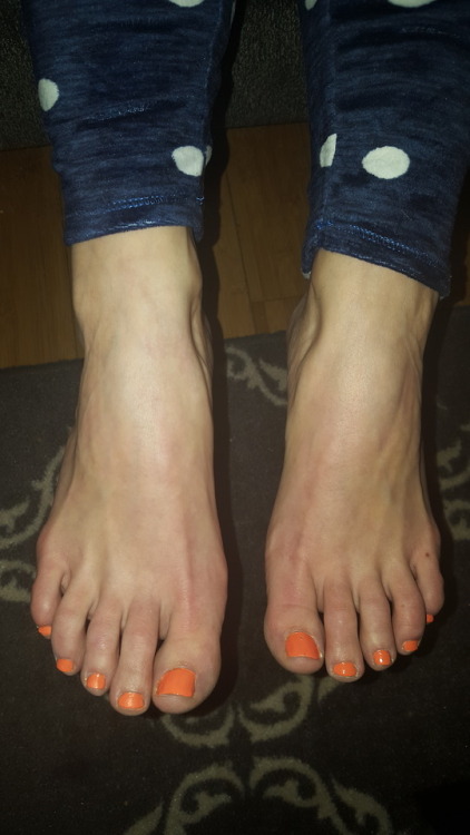 my pretty wifes delicious orange toes.please comment