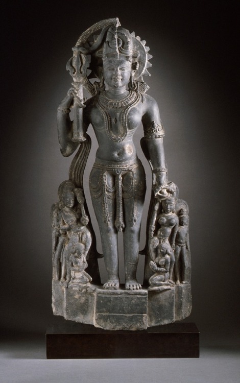 The androgynous form of Shiva and Parvati (Ardhanarishvara).  Artist unknown; 11th century.  From In