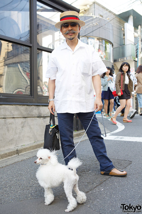 50-year-old Harajuku guy in a boater hat with his 4-year-old toy poodle Valentino. Full Look