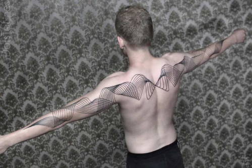 Optical illusion tattoo arm