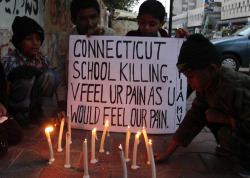  Pakistani children light candles to pay tribute to Sandy Hook Elementary School shooting victims in southern Pakistani port city of Karachi on Dec. 15, 2012. This will never be on the news. But how awesome of this picture to see some light. 