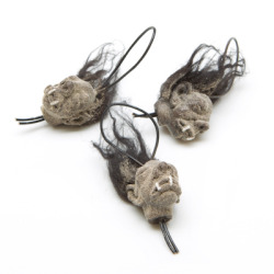 Great present for those who are keen on creepy things!  BTW, Christmas is coming :) These ghoulish shrunken head ornaments are available right here.