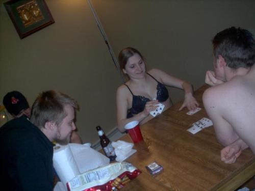 A girl in a rather amazing bra plays strip poker in the middle of someone’s birthday party, and ends