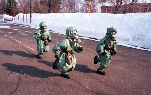 scavengedluxury:  Children at a civil defense drill. Photo by Oleg Nikishin, Kineshma, Russia, 1999.