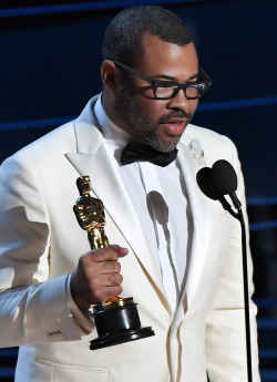 celebsofcolor: Jordan Peele accepts Best Original Screenplay for ‘Get Out’ onstage during the 90th Annual Academy Awards at the Dolby Theatre at Hollywood &amp; Highland Center on March 4, 2018 in Hollywood, California.