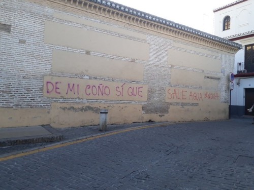 “Holy water comes out my pussy” painted on a church in Granada, Spain