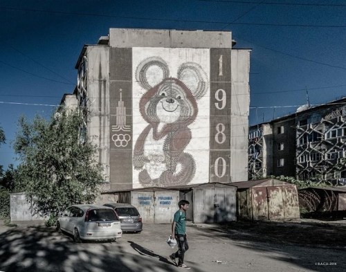 Olympic mascot Mishka (1980) on an apartment block in Osh, and a few more facades from the same neig
