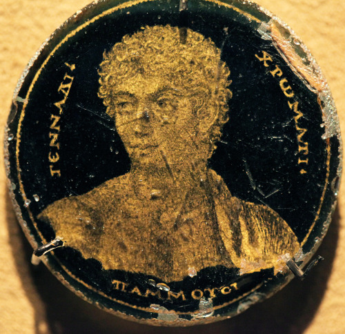 romegreeceart:A portrait on a glass disc; Roman Egypt 3rd Century AD. Painting depicts Gennadios, wh