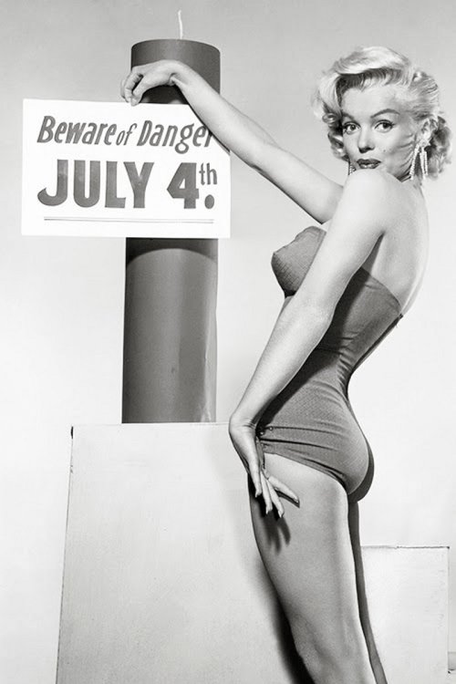Marilyn Monroe and a big firecracker on the 4th of July.