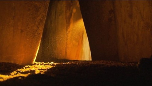 Winter light filters through the 5000 year old passage tomb at Newgrange in the Boyne Valley, Irelan