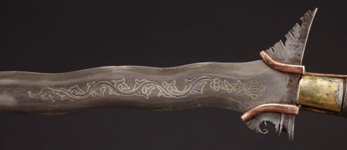 art-of-swords:  Moro Kris Sword  Dated: 19th century Geography: Southern Philippines Measurements: overall length 27" (68.58cm); blade length 21" (53.34cm) The handle has a burl wood pommel, and a variety of wrappings of rattan and twine. The