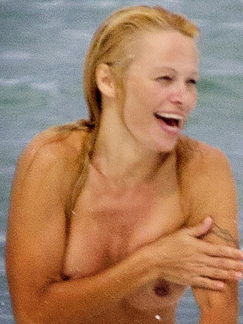 toplessbeachcelebs:  Pamela Anderson (Actress) swimming topless in France (June 2013)