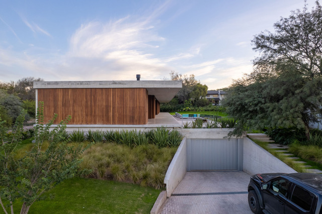 A Wood And Concrete House That Opens To A Welcoming Pool [Video]