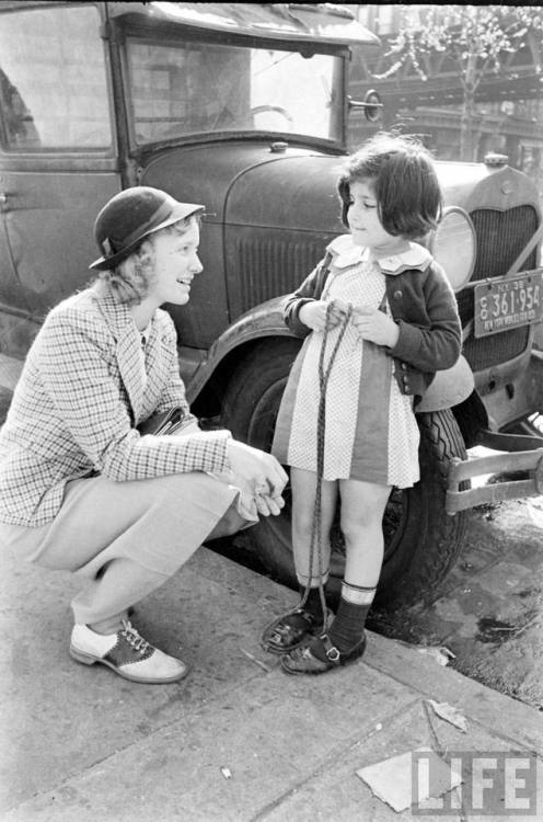 Sarah Lawrence student interviews a child on the street(Alfred Eisenstaedt. 1938?)